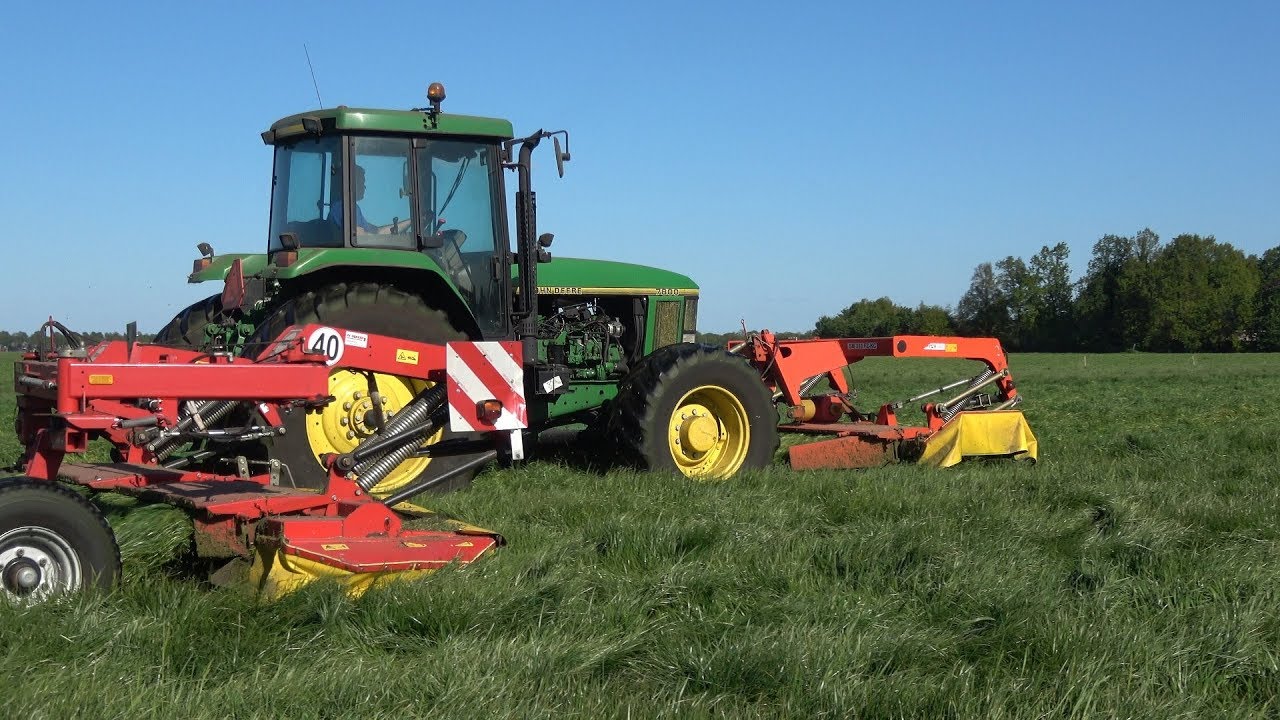 John Deere 7800 met Fella SM 310 FZ-KC en SM 401 Trans-KC aan het gras maaien (2019)