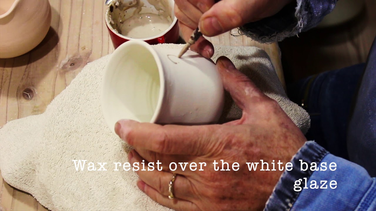Making/throwing a ceramic clay pottery Yunomi in Japan on the wheel.