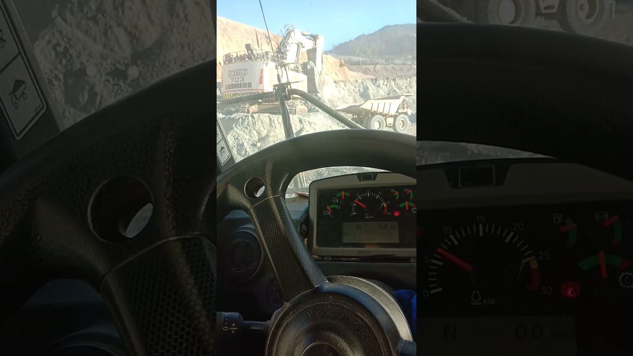 Loading LIEBHERR 9350 VS CAT 777 MINING GOLD BATU HIJAU WEST SUMBAWA