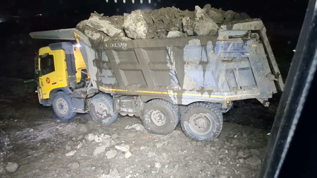 backhoe loading dump truck