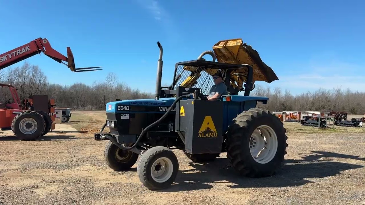 Lot 6640 Ford New Holland Tractor with Alamo Side Boom