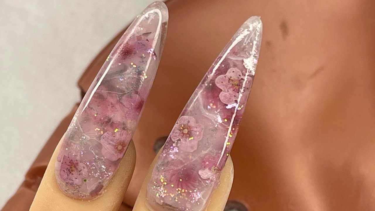Encapsulated cherry blossoms 🌸 ￼using @youngnailsinc cover bare powder and build pink synergy gel 