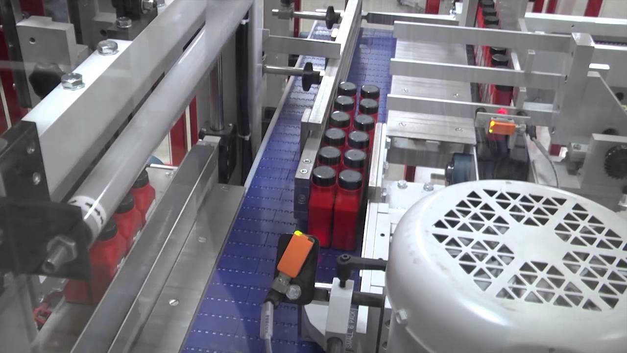 SV251 Side Feed Automatic with servo collator, infeed conveyors wrapping bottles of oil