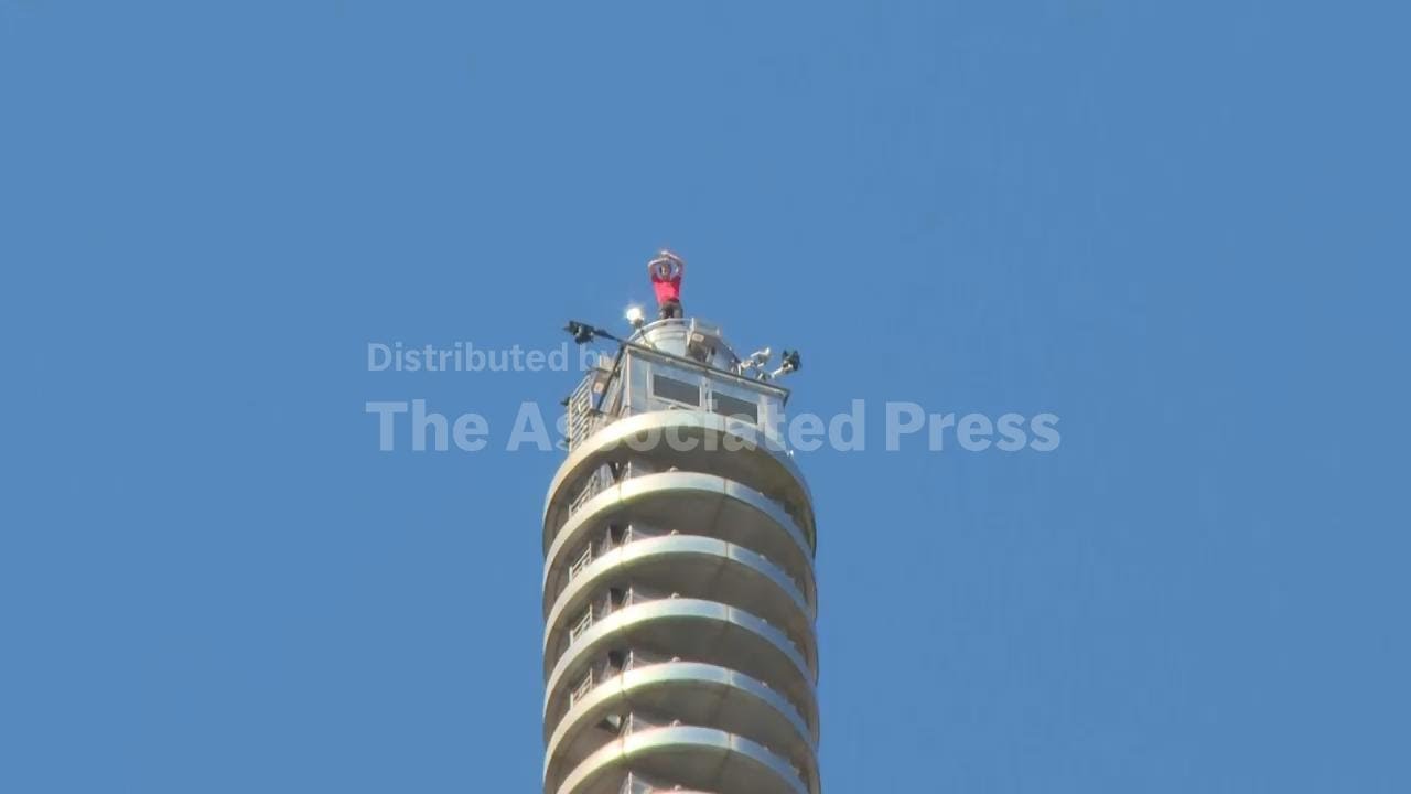 Final moments of Alex Honnold's successful free climb of Taipei 101 tower in Taiwan