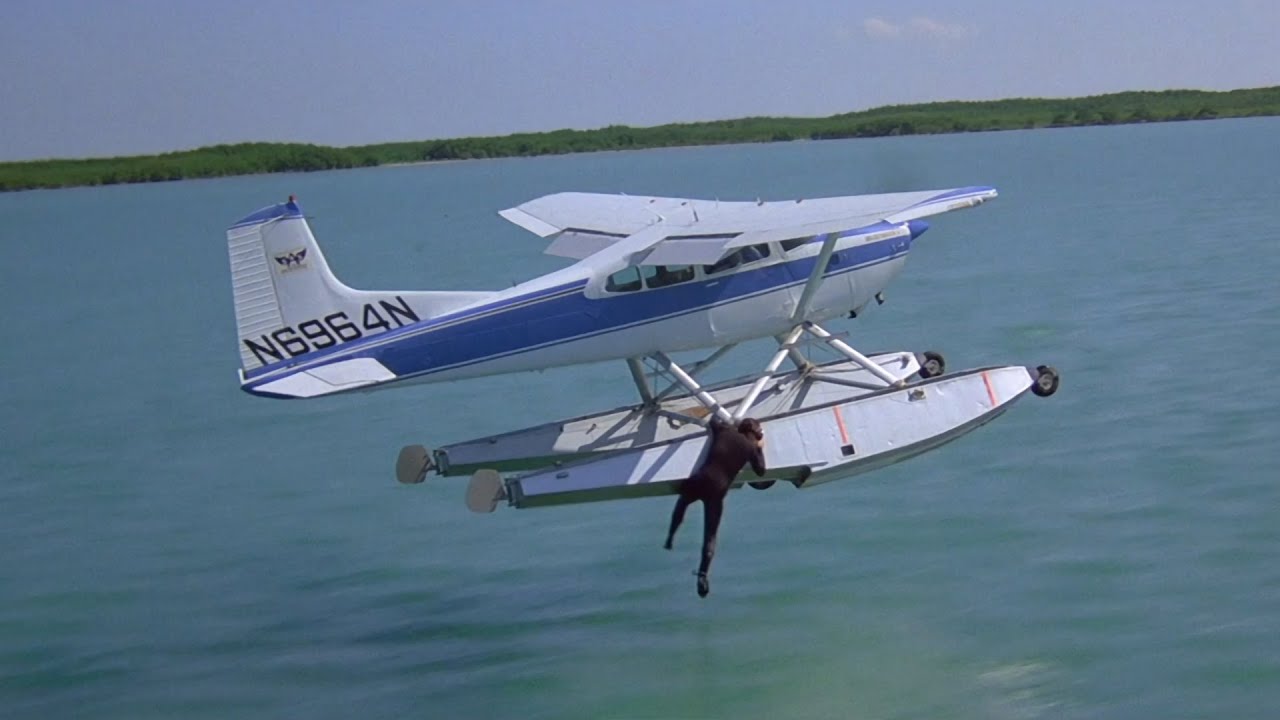 Bond goes barefoot water-skiing behind harpooned seaplane - License to Kill movie vs Amiga game