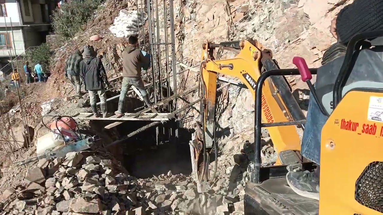 Mini excavator work hard cutting break hard at Shimla Himachal 