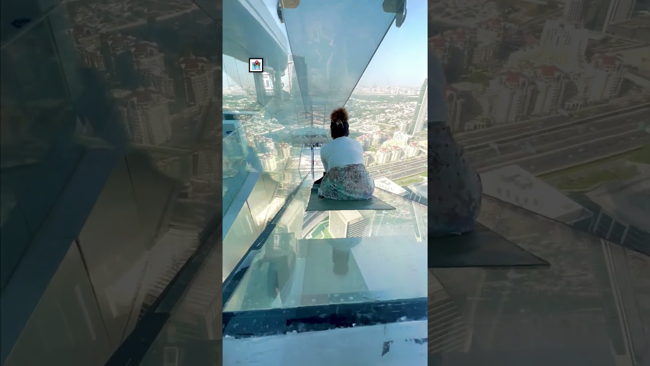 Sliding down a glass slide from the top of a skyscraper! 😮🫣  -  🎥 BVIRAL / preety_qummie