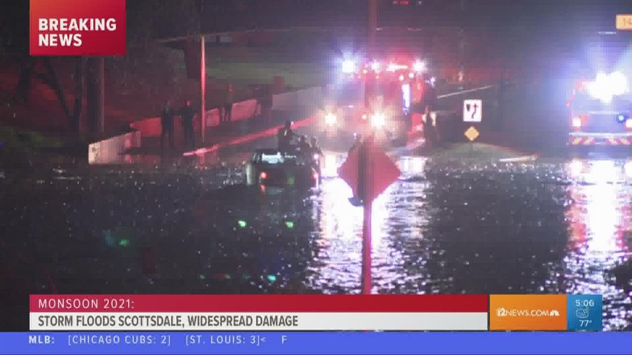 Driver gets stuck in flooded road during storm in Scottsdale