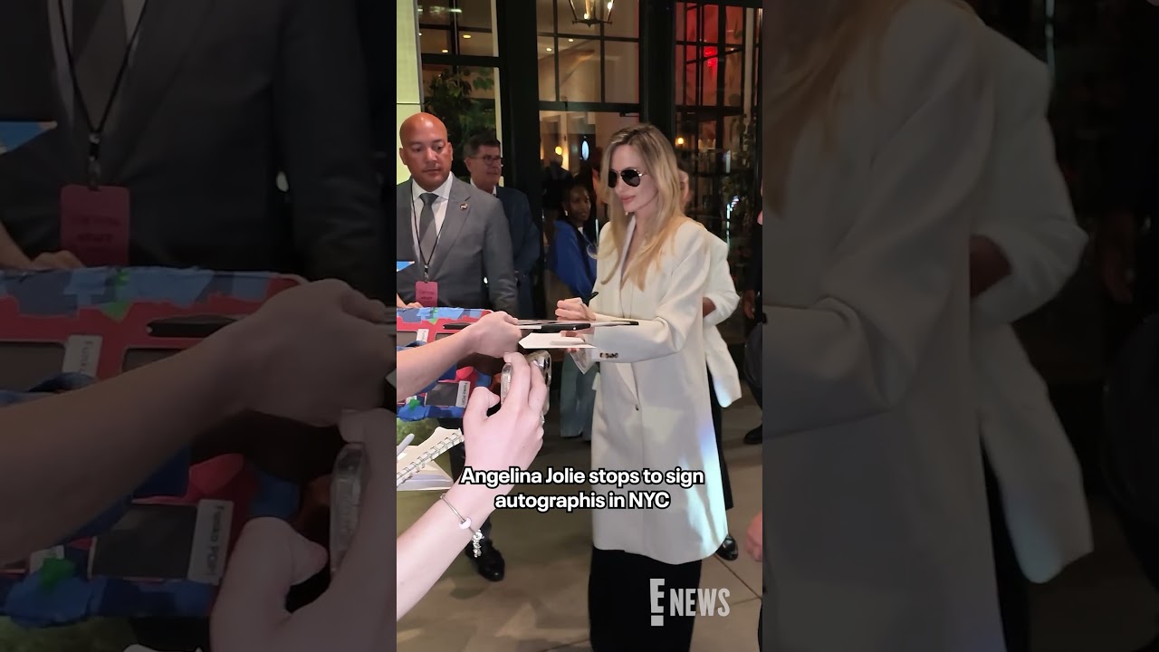 Angelina Jolie stopped for fans to sign autographs as she left a screening of her new film 