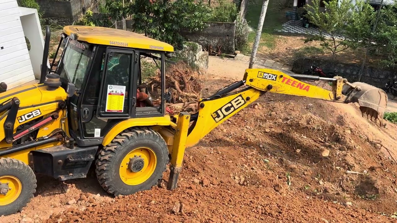 Jcb 3dx levelling loose soil and making road to property 