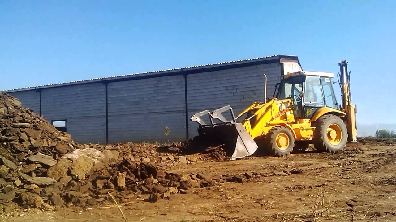 JCB 3CX digger - loader at work