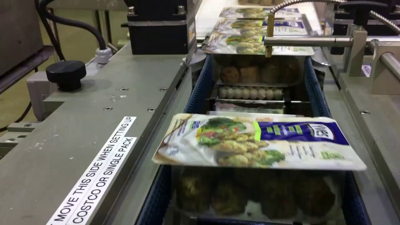 Packaging Division - Labeling and Lidding Film Application Machine