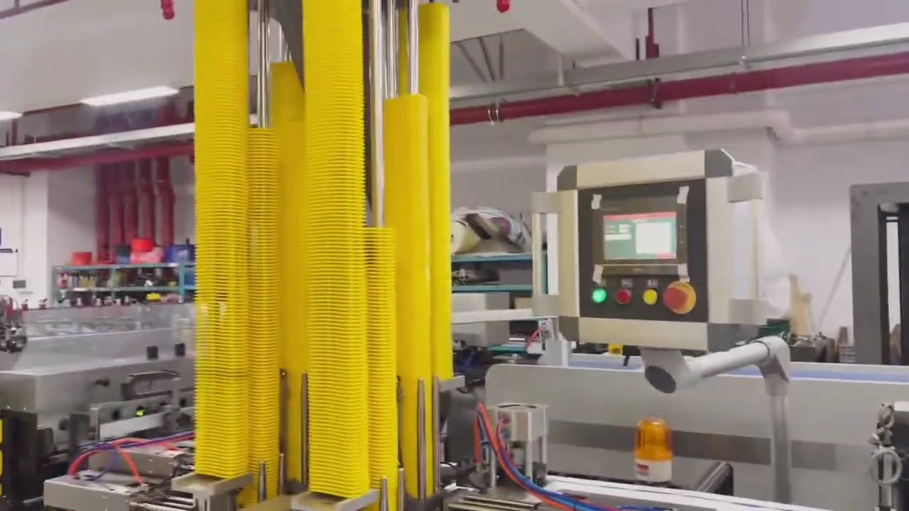 Machine for making stand-up pouches with a spout and handle