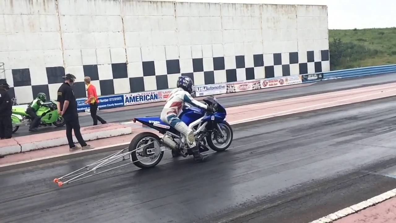 Sv1000s Drag bike with wheelie bars launching on the rev limiter