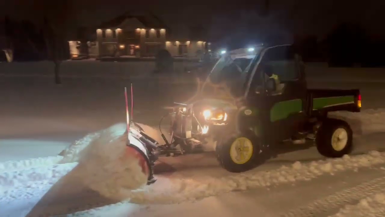 Snow plowing with my John Deere gator