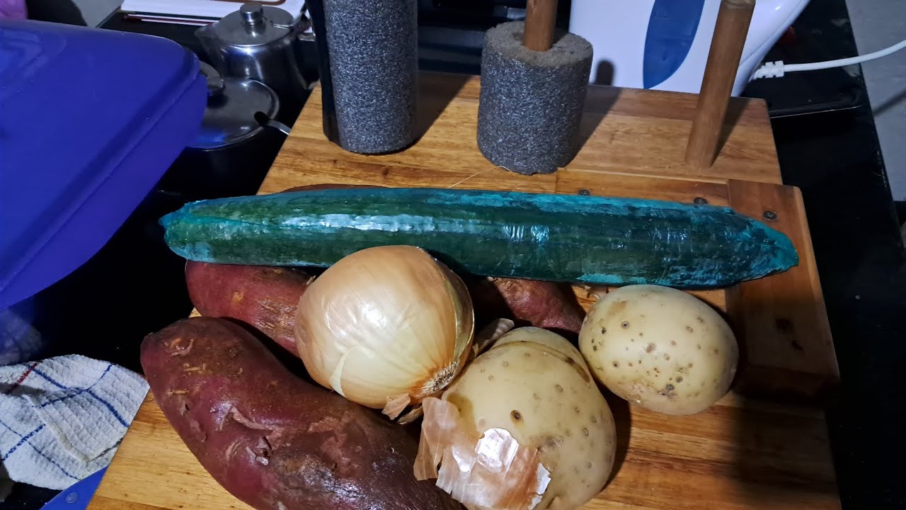 PEELING VEGGIES .WITH A ONE HAND CUTTING BOARD