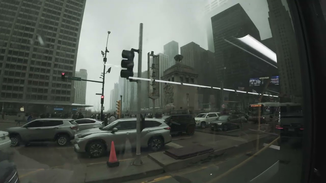 Snowy bus ride through busy chicago 