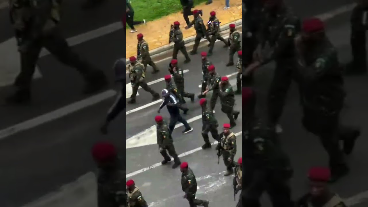 Guinea President Mamady Doumbouya takes his morning routine walk under a heavy military forces
