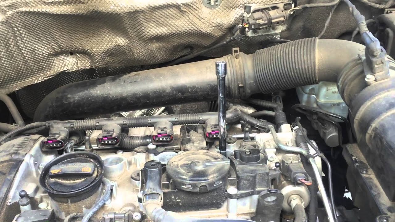 Замена свечей зажигания VW Tiguan 2011 года