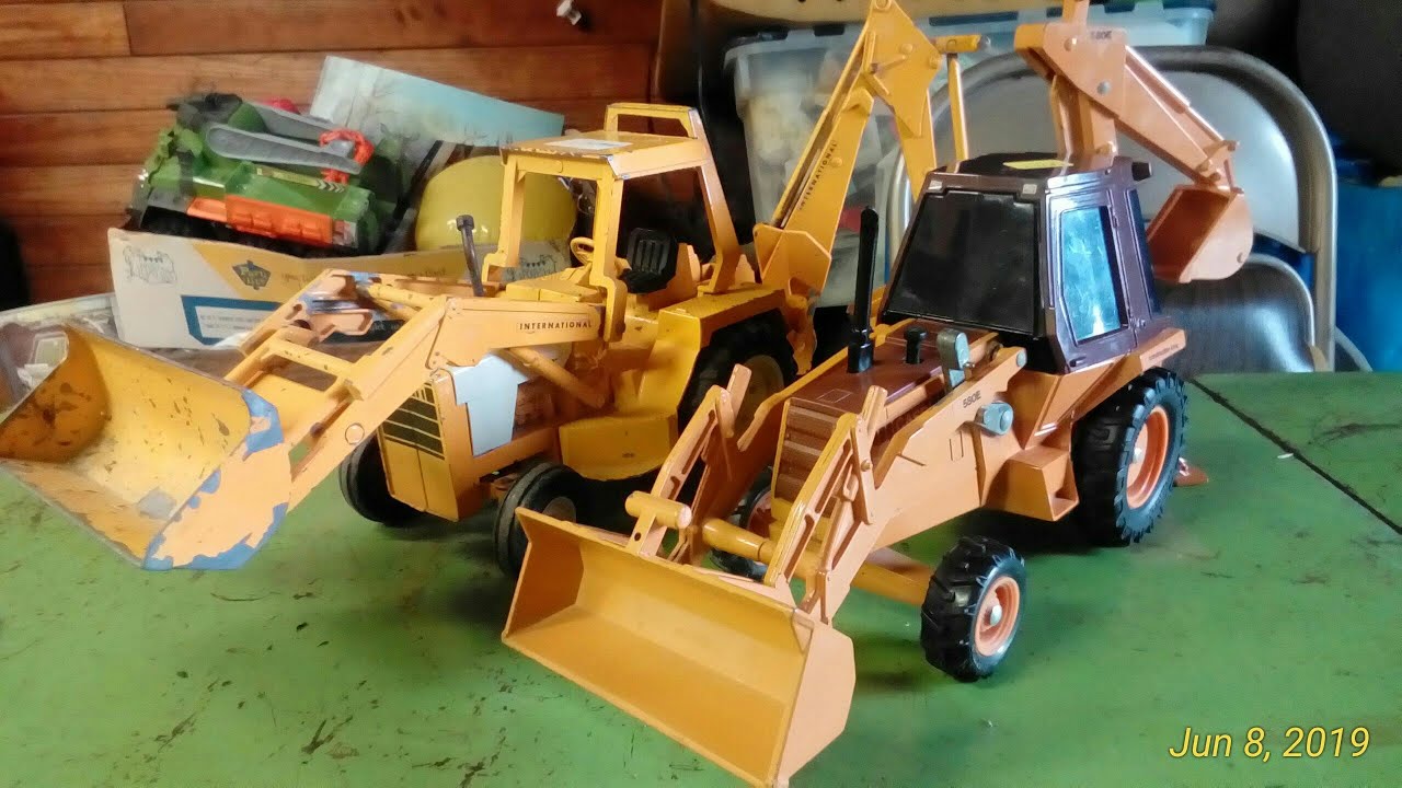 Old Vs. New Ertl Backhoe