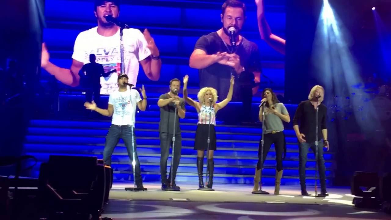 Luke Bryan and Karen Fairchild singing "Home Alone" when a cricket goes down Karen's shirt