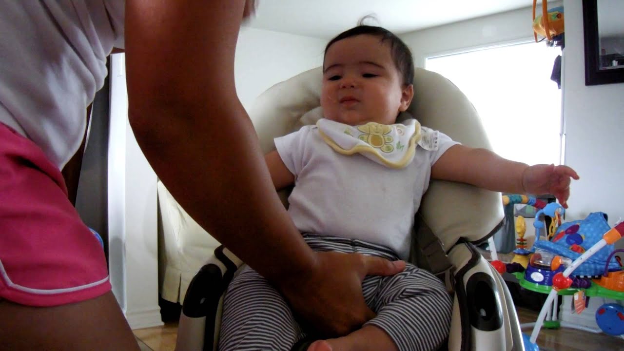 Trying to get Aiden in his highchair