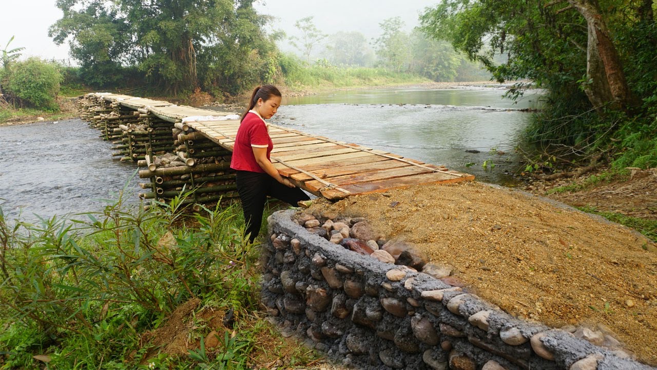 Building a bamboo bridge to the island off grid - Build stone pier foundations at both ends