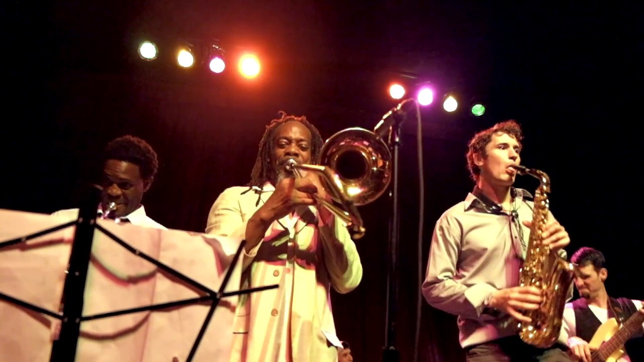 Tim Watson plays reggae with horn section.