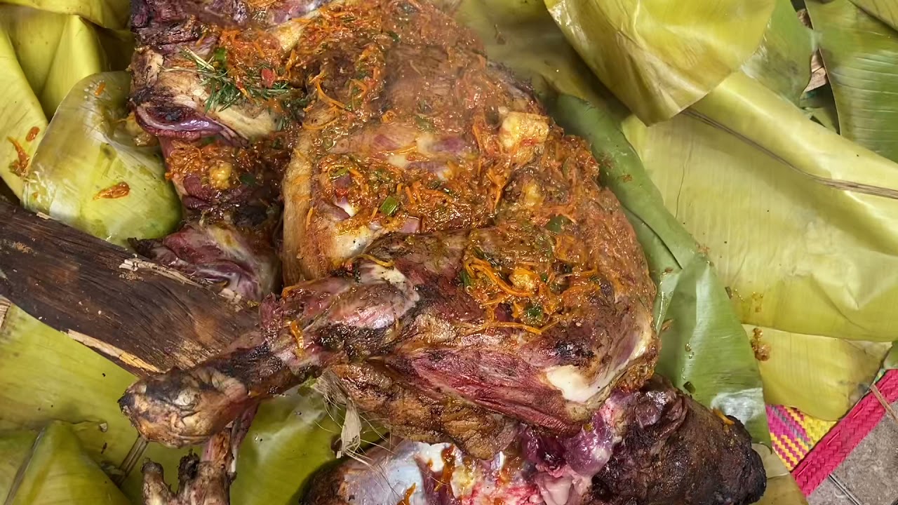 A whole Goat Luwombo steamed in banana leaves