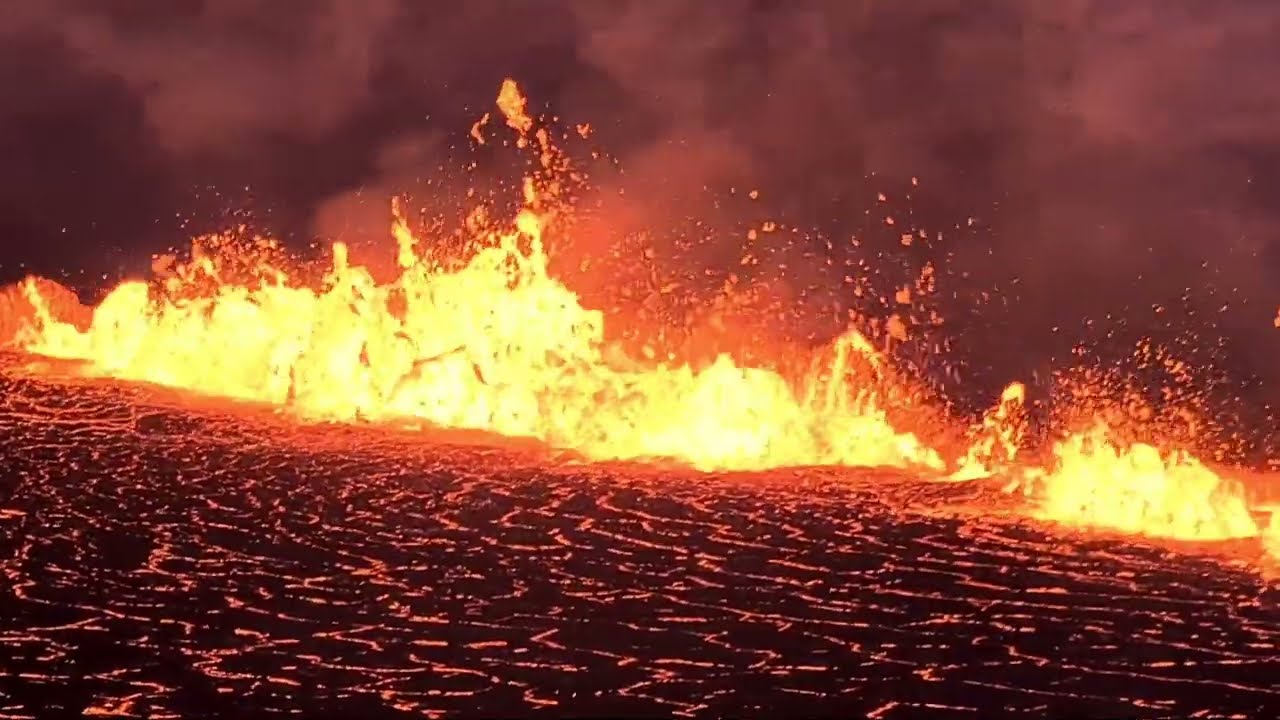 Long fissure spewing tons of lava in Meradalir, Iceland. As seen from the hill. 03.08.22