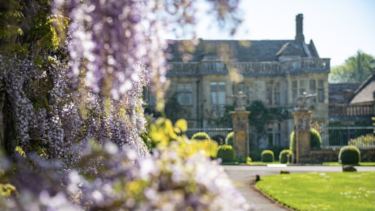 Gentle Yoga in front of our 350 year old Coach House & Wisteria