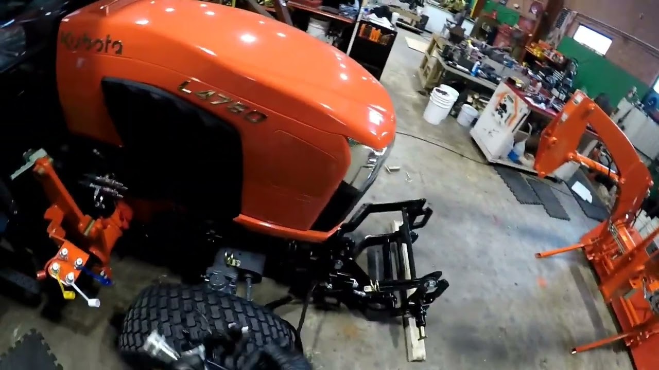 removing the 4 point hitch [snowblower subframe]  off a Kubota grand L 4760 cab tractor