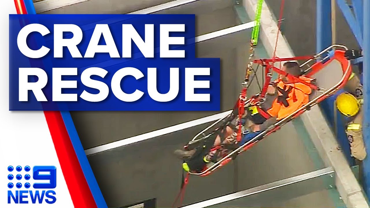 Injured worker rescued from crane at Melbourne building site | 9 News Australia