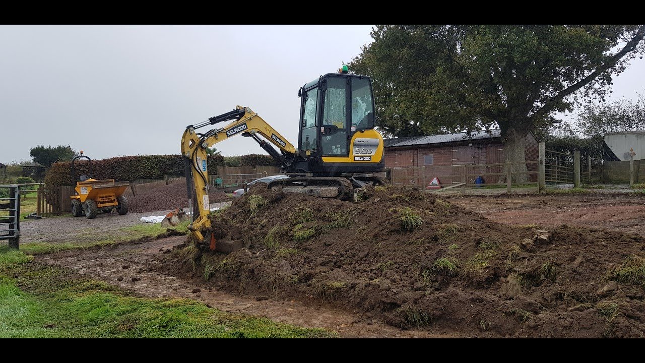 Digging out a parking area with a Yanmar Mini Digger excavator