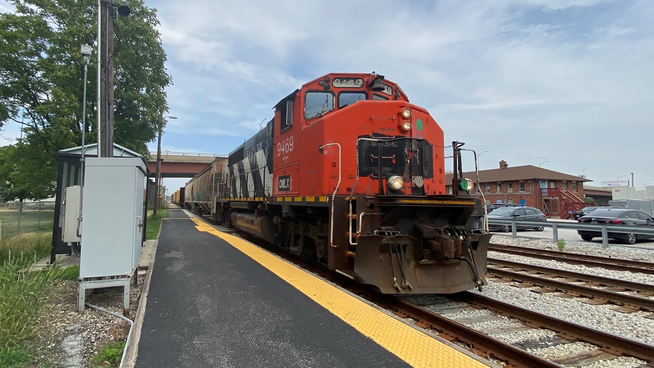 OMLX #9469 and Omlx #4200 lead a local freight at prairie street, Blue island, Illinois