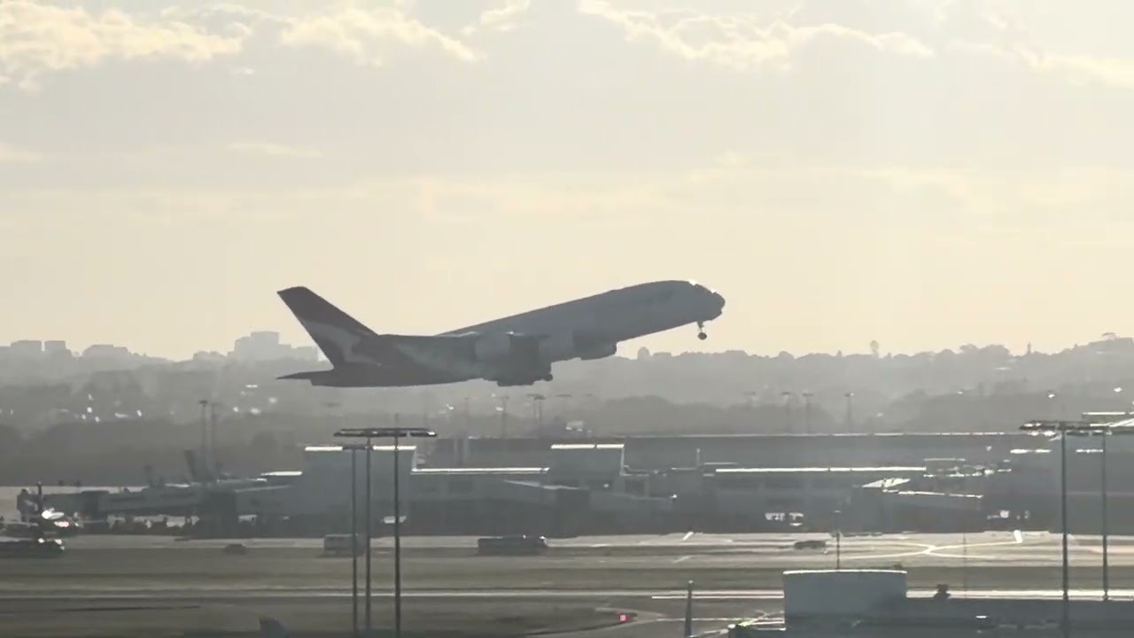 PLANE SPOTTING TAKES OFF AND LANDING AT SYDNEY AIRPORT IN DAY EVENING AND NIGHT.