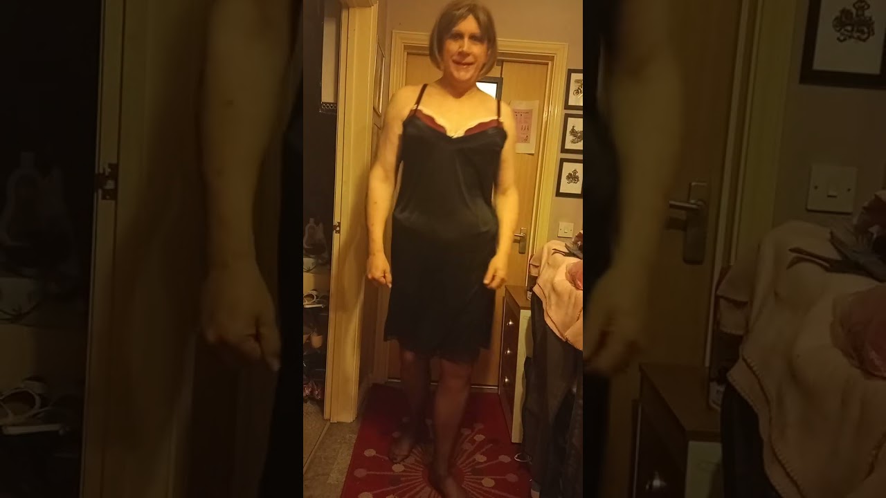 Marianna tightens her corset. Crossdresser