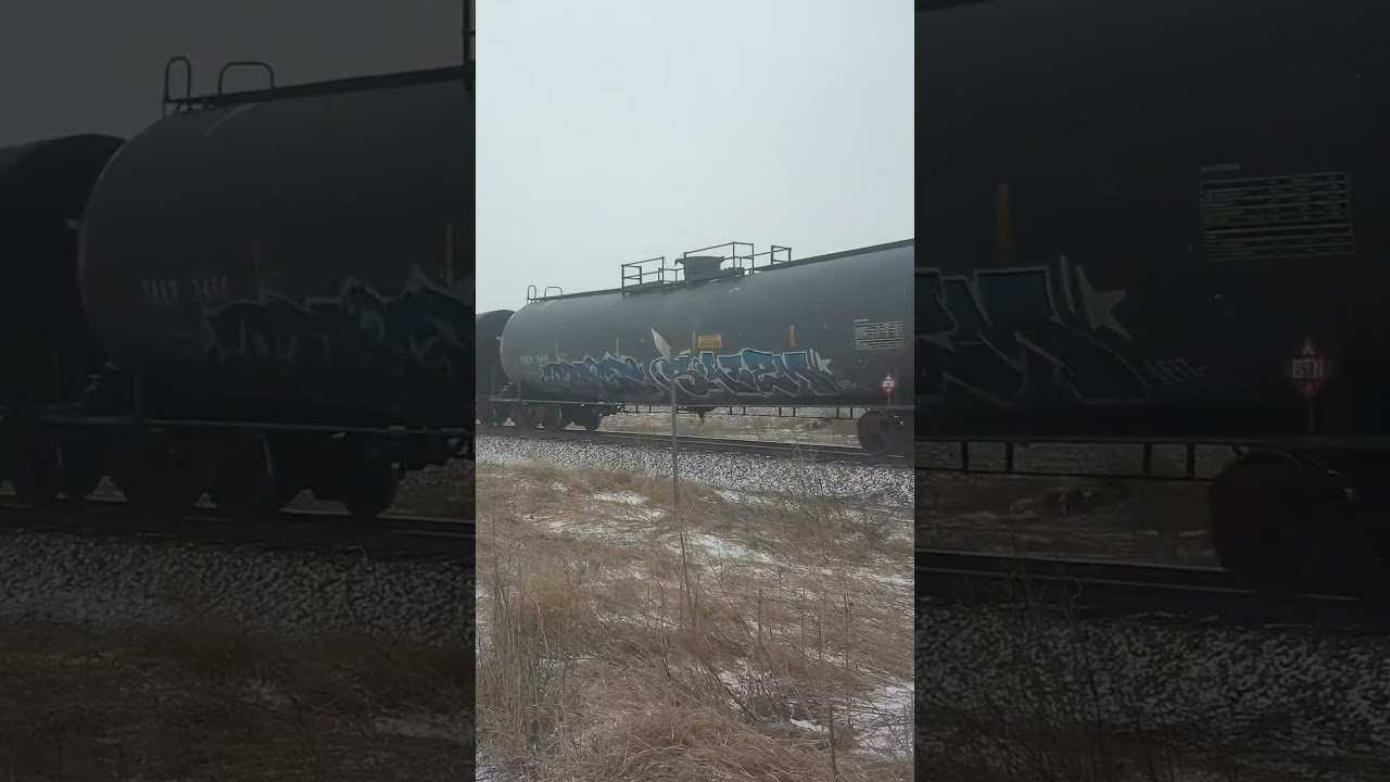 Northbound Union Pacific train with UP 6706 again in the snow on the Spine Line