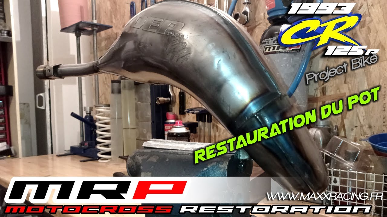 Restauration du pot DEP de la 125 CR . On enlève les bosses et on refait les soudures apparentes