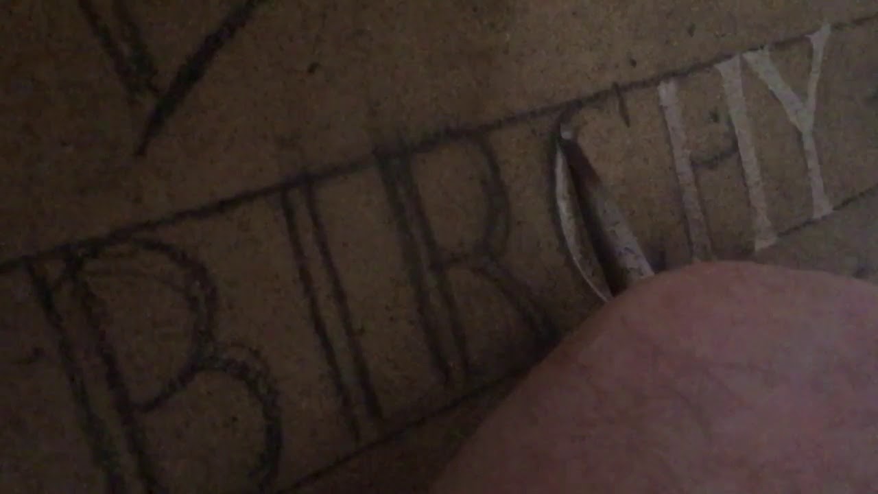 Slow motion of hand cut lettering in sandstone
