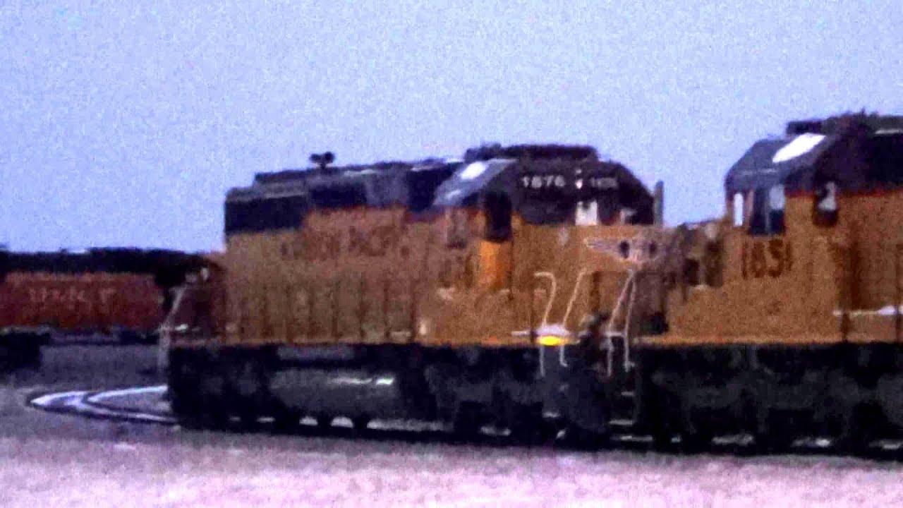Cando, UP, and BNSF Engines at RELCO Locomotives in Twilight
