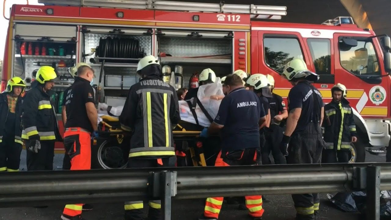Firefighters tend to victims of deadly bus accident in Hungary | AFP