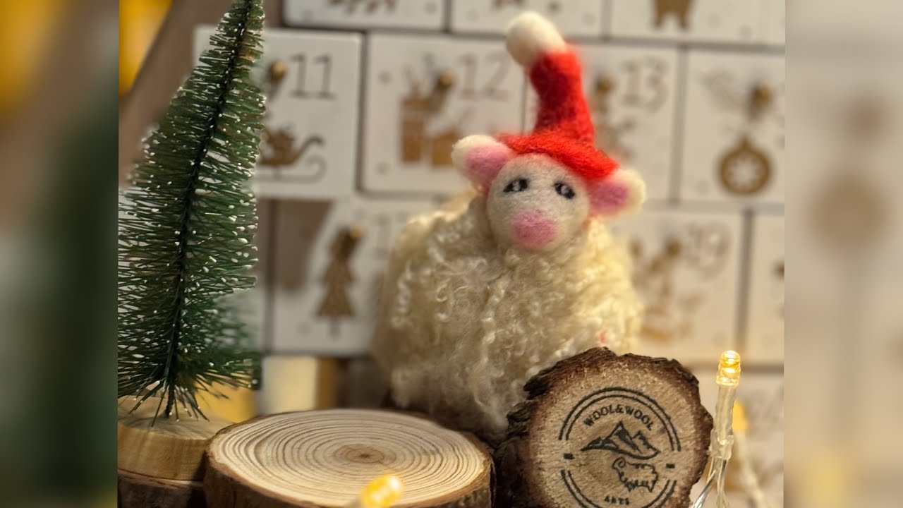 Felt advent calendar Day 11/ needle felted woolly sheep in red hat. 
