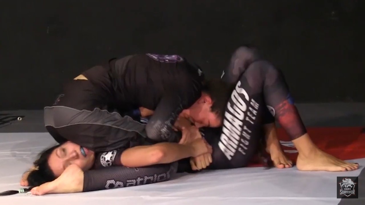 Women Grappling: Eleni Moisidou is being controlled on the ground.