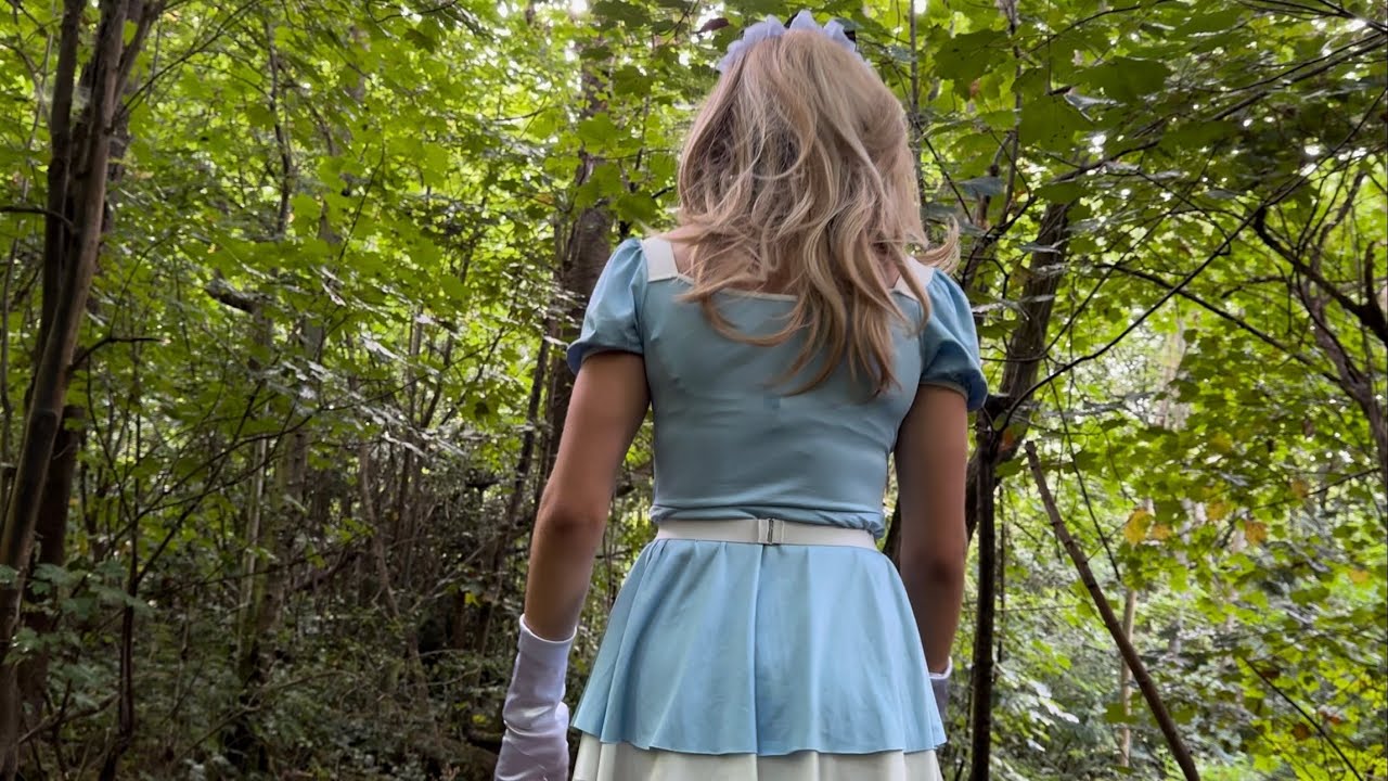Sissy in blue French maid uniform in forest