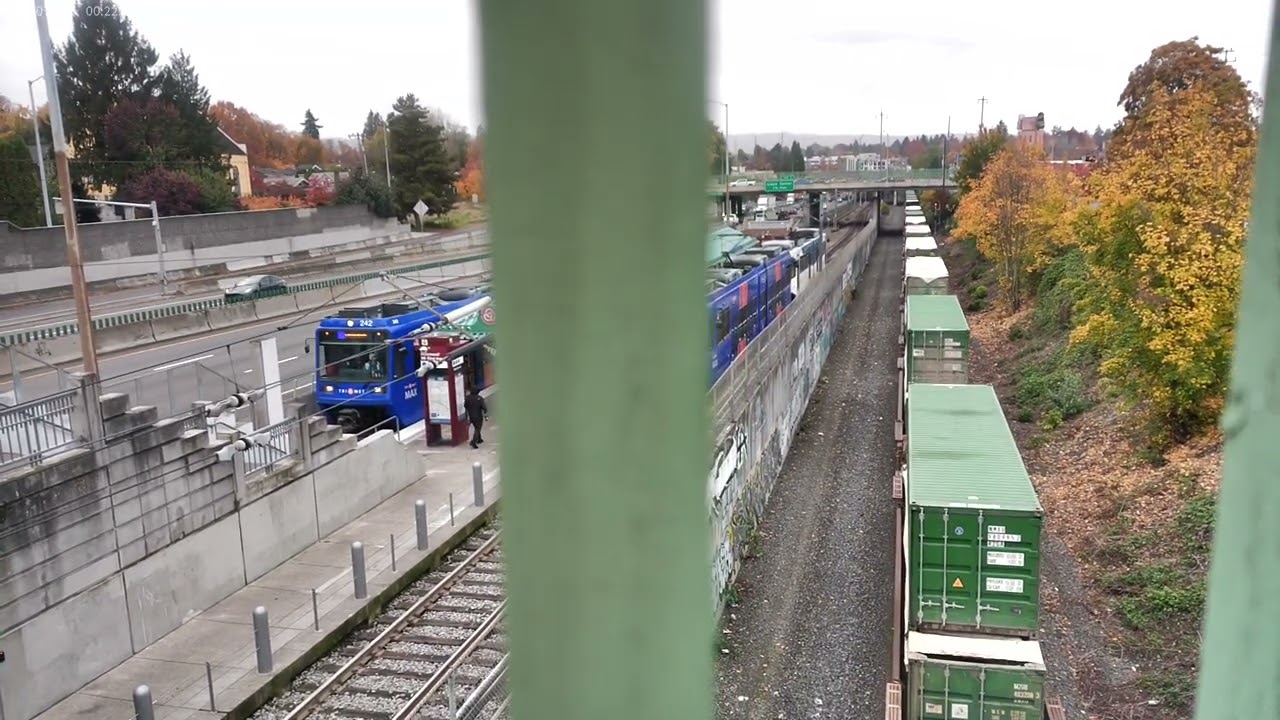 Union Pacific pulling a garbage train past the Hollywood/NE 42nd Ave Max Stop in Portland OR 110524