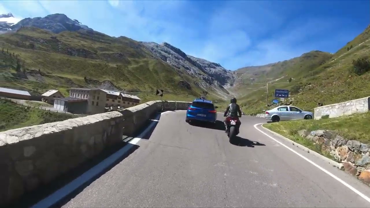 africa twin chasing racer on Passo dello Stelvio