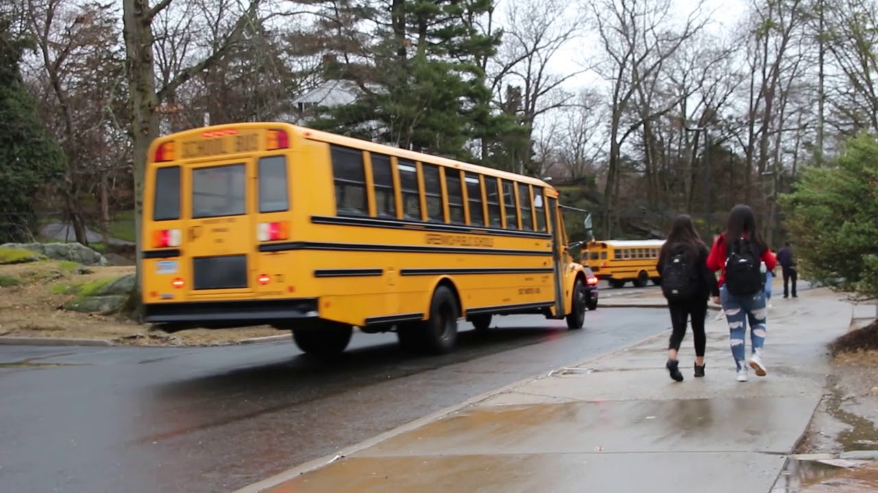 Some of the 29 school buses departing Greenwich High School