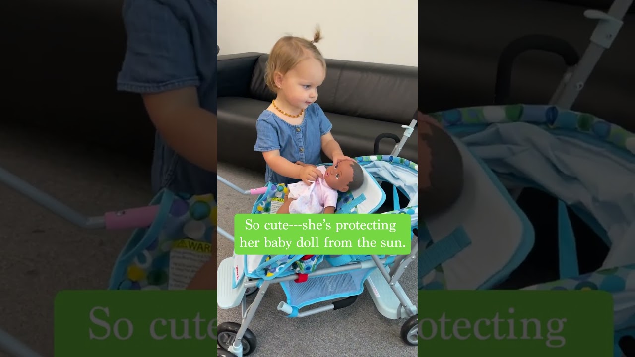 Little Girl Using the Caboose Stroller Toy!