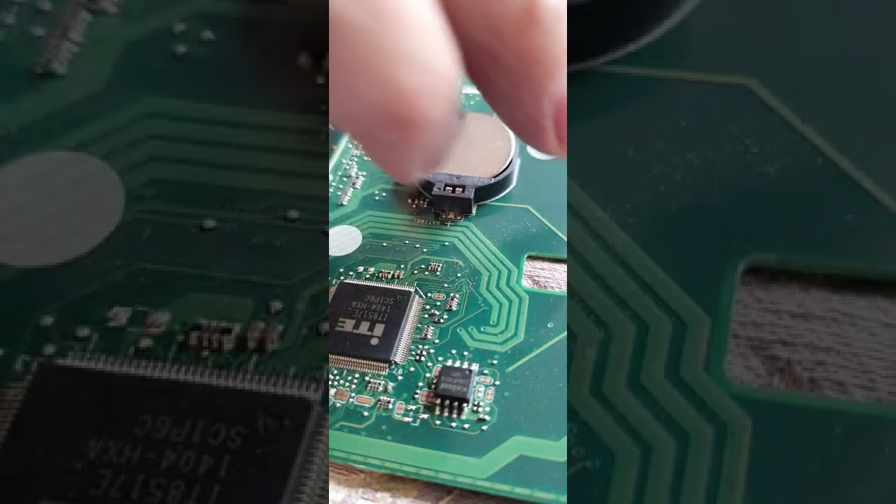 Securing the CMOS Battery when tabs broken with hot glue! Motherboard woes.